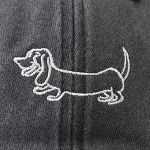 Charcoal grey washed cotton baseball cap featuring white embroidered dachshund dog outline