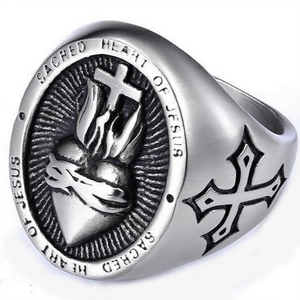 Vintage stainless steel ring featuring Sacred Heart of Jesus and cross relief patterns