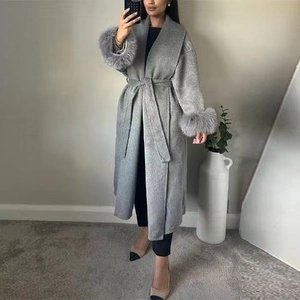 Grey wool blend long coat with belted waist and stylish faux fur trim on cuffs