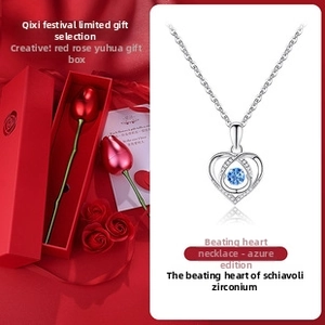 Detail of S925 silver heart necklace with blue stone and rose gift box packaging