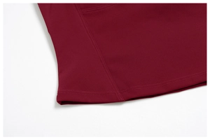 Detail of burgundy yoga set featuring double-needle stitching and smooth knit fabric texture