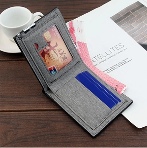 Detail view of grey fabric men's wallet with multiple card slots and cash capacity