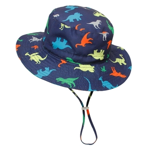 Detail of adjustable windproof strap and dinosaur print on kid's sun hat