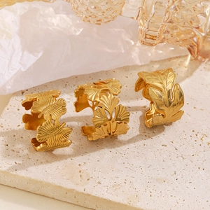 Minimalist 18K gold plated stainless steel leaf rings in monstera and ginkgo leaf designs