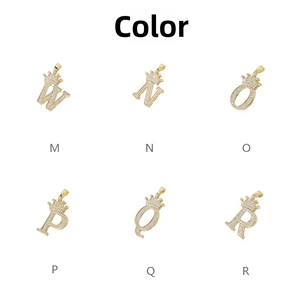 Macro detail of gold crown alphabet pendants M-R with inlaid cubic zirconia crystals