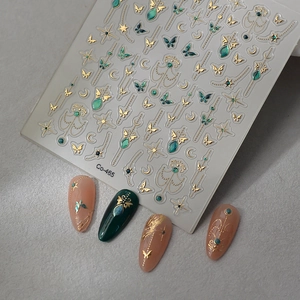 Blue butterfly nail stickers with gold foil stars and moon designs for manicure art