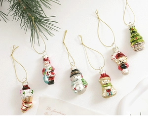 Detailed overhead view of festive electroplated glass Christmas ornaments in various shapes