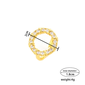 Gold-plated ring with pavé zircons and X-cross pattern, showing 1.8cm inner diameter