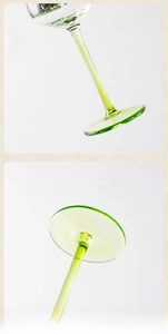 Detail showing the slender light green stem and stable wide base of the hand-painted glass