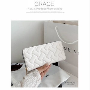 Close-up of ivory PU leather long wallet with woven texture and gold zipper detail