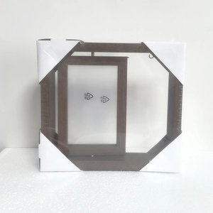 Close-up of dark brown wood grain picture frame with protective corner packaging