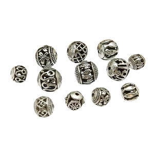 Group of 11 vintage Tibetan silver hollow spacer beads with Celtic knot patterns for jewelry