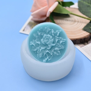 Peony flower relief silicone mold with blue handmade soap on a decorative tray