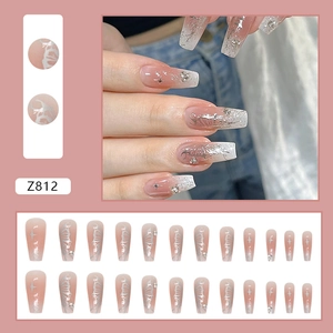 Long ballerina press-on nails with nude gradient, silver butterfly, and sparkling rhinestones