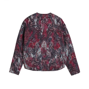 Back view of a quilted jacket with vintage abstract patterns and round neck design