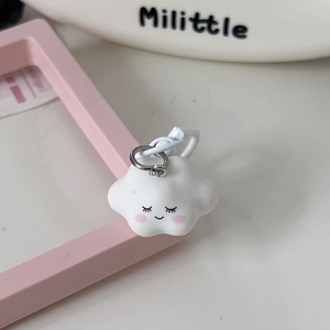Close-up of a 3D cute white cloud pendant with a smiling face and pink blush detail