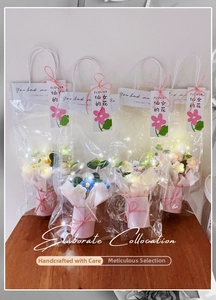 Detailed set of four handmade crochet flower bouquets with LED lights in gift bags
