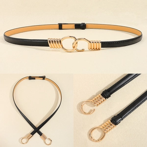 Detail view of adjustable black leather belt featuring elegant gold metal buckle hardware