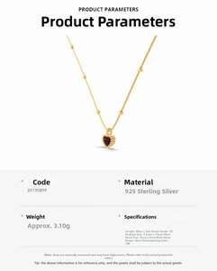 Detail view of gold S925 sterling silver heart necklace with red zircon and 18K plating