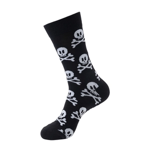 Detail of black cotton mid-tube socks featuring white skull and crossbones punk pattern