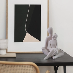 Modern minimalist ceramic hugging couple figurine with matte grey finish for home decor