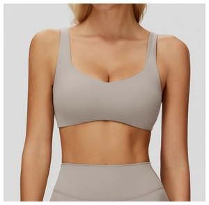 Detail of mocha yoga bra with deep U-neck and elastic high-waisted fitness leggings