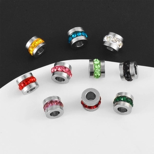 Macro shot of stainless steel spacer beads with colorful rhinestones for DIY jewelry