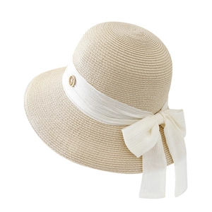 Elegant wide brim straw sun hat for women with white chiffon bow and gold buckle detail