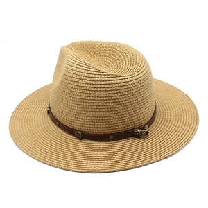Women's wide brim straw hat in beige with brown leather band and metallic studs