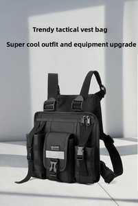 Detail view of black tactical vest bag showing multiple pockets and reflective stripe