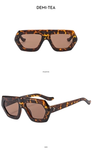 Close-up of demi-tea thick frame sunglasses in positive and side views on white backdrop