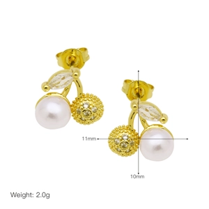 Detail view of gold cherry earrings with white pearls and sparkling cubic zirconia