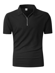 Macro detail of men's black waffle knit polo shirt with zipper collar and 100% polyester fabric