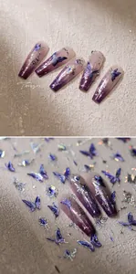 Detail of purple gradient coffin press-on nails with blue butterfly and silver glitter