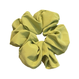 Elegant fruit green oversized chiffon scrunchie with soft ruffled texture for high bun hair