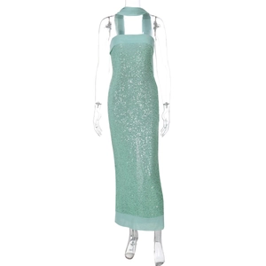 Detail of mint green sequin long dress with matching scarf on a professional mannequin