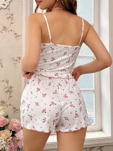 Detail of floral lace-up pajama set with pink lettuce edge trim on soft ribbed fabric