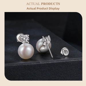 Macro detail of S925 sterling silver screw-back earring with white pearl and moissanite