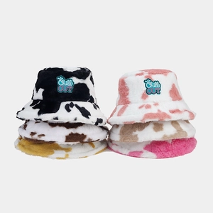 Winter plush bucket hat with cow pattern and Chill OUT embroidery for stylish warmth