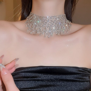 Close-up of luxury rhinestone tassel choker necklace with shimmering mesh detail on neck