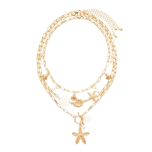 3-layer gold ocean necklace featuring starfish, shell, pearl and conch pendants