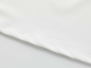 Detailed macro shot of white high-elastic knit fabric with durable double-needle stitching