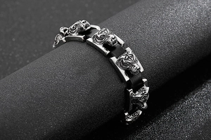Macro detail of men hip hop stainless steel tiger head link bracelet with braided leather