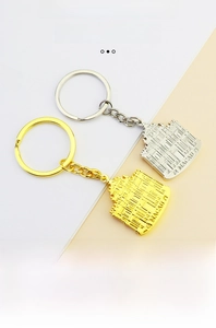 Detailed relief of Macau Ruins of St. Paul's on gold and silver metal keychains