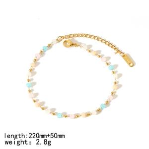 Detail of 18k gold plated titanium steel anklet with colorful natural stone beads