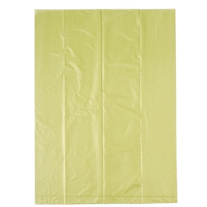 Detail view of yellow biodegradable pet waste bag showing material texture and size