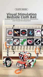 High-contrast black white and red sensory cloth book with soft hanging activity cubes