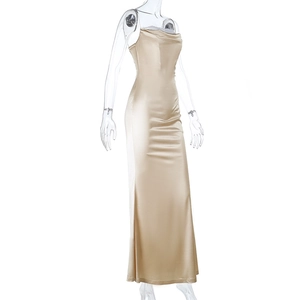 Detail of champagne gold satin maxi dress with lace neckline and slim fit silhouette