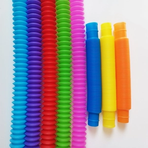 Colorful sensory pop tubes shown in both extended and compressed states on white background