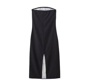 Detailed close-up of the front high slit design with white contrast lining on black dress